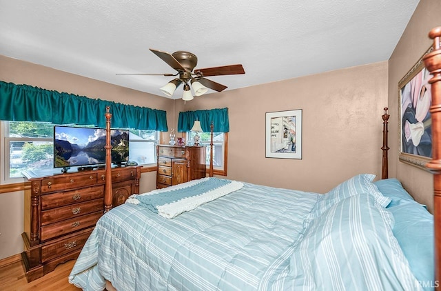 26051 Lake Dr, Elkhart, IN 46514 - bedroom with wood finished floors and a ceiling fan