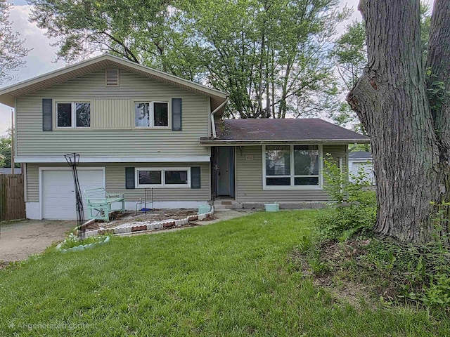 4910 Devonshire Dr, Fort Wayne, IN 46806 - tri-level home with an attached garage and concrete driveway