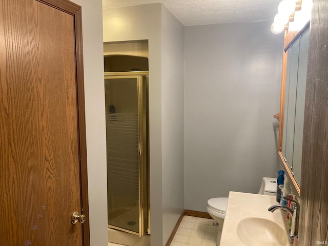 305 N Lincoln Ave, Fowler, IN 47944 - bathroom with a sink, a shower stall, toilet, baseboards, and a textured ceiling