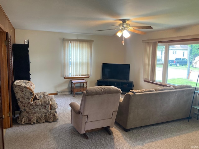 305 N Lincoln Ave, Fowler, IN 47944 - living room featuring baseboard heating, light colored carpet, and a ceiling fan