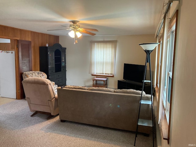 305 N Lincoln Ave, Fowler, IN 47944 - living room featuring ceiling fan, carpet, wooden walls, and plenty of natural light
