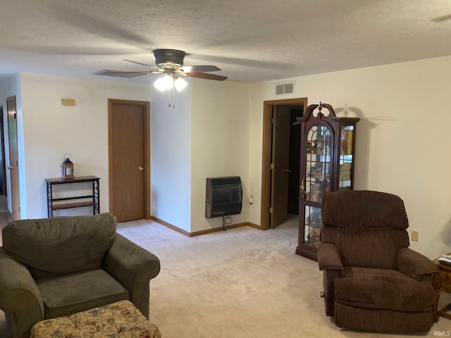 305 N Lincoln Ave, Fowler, IN 47944 - living area with heating unit, ceiling fan, light colored carpet, a textured ceiling, and baseboards