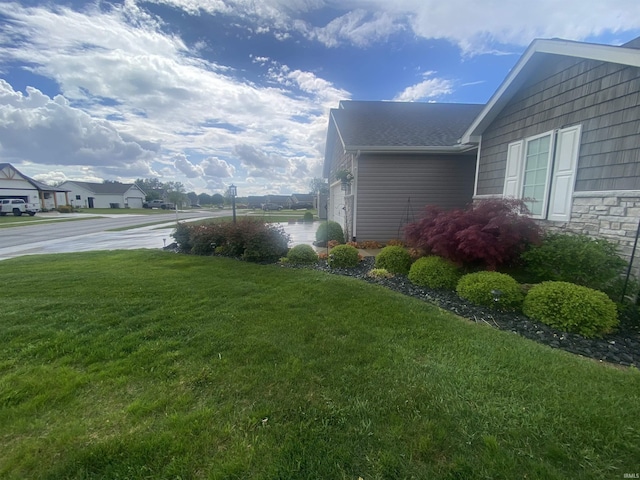 4310 E Duffy Dr, Syracuse, IN 46567 - view of home's exterior with a yard and stone siding