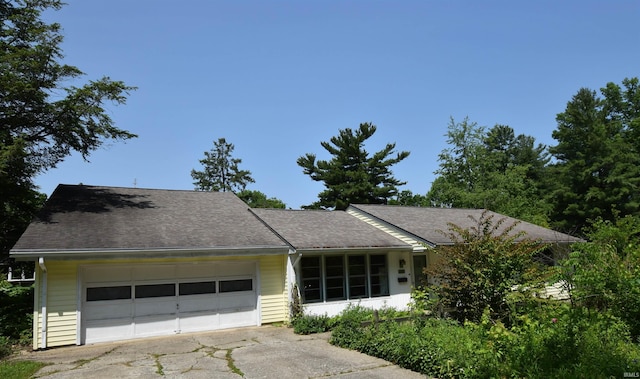 1200 S Longwood Dr, Bloomington, IN 47401 - view of front of house with an attached garage and asphalt driveway
