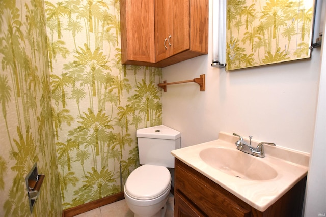 1200 S Longwood Dr, Bloomington, IN 47401 - bathroom with wallpapered walls, vanity, and toilet