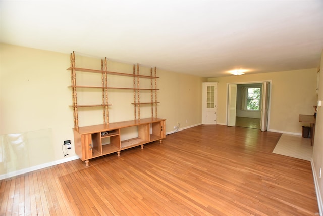 1200 S Longwood Dr, Bloomington, IN 47401 - unfurnished living room featuring light wood-type flooring and baseboards