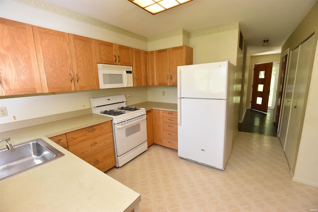 1200 S Longwood Dr, Bloomington, IN 47401 - kitchen with white appliances, light countertops, a sink, and light floors