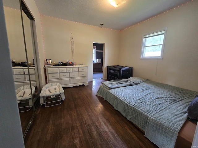 220 W Main St, Greentown, IN 46936 - bedroom with dark wood-style flooring