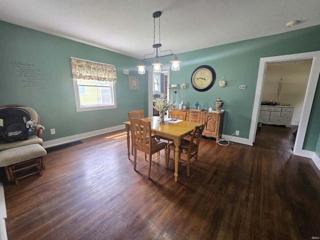 220 W Main St, Greentown, IN 46936 - dining area with dark wood-type flooring and baseboards