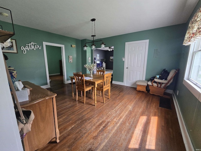 220 W Main St, Greentown, IN 46936 - dining room featuring dark wood-style floors and baseboards
