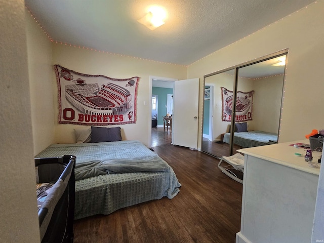 220 W Main St, Greentown, IN 46936 - bedroom with wood finished floors, a closet, and baseboards