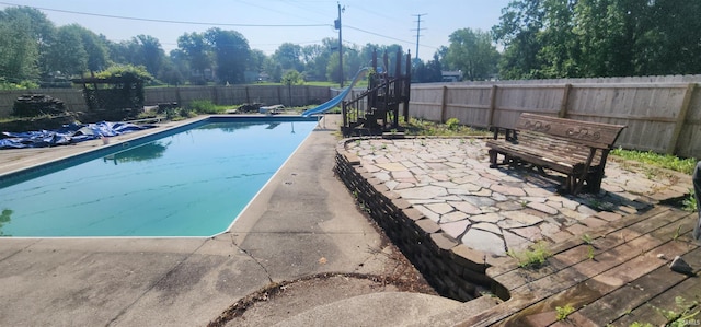 5002 Canterbury Dr, Fort Wayne, IN 46835 - view of pool with a water slide, a fenced backyard, and a patio