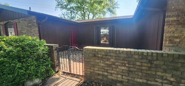 5002 Canterbury Dr, Fort Wayne, IN 46835 - view of property exterior featuring brick siding and a gate