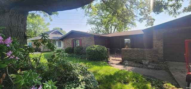 5002 Canterbury Dr, Fort Wayne, IN 46835 - view of front facade featuring brick siding and a gate