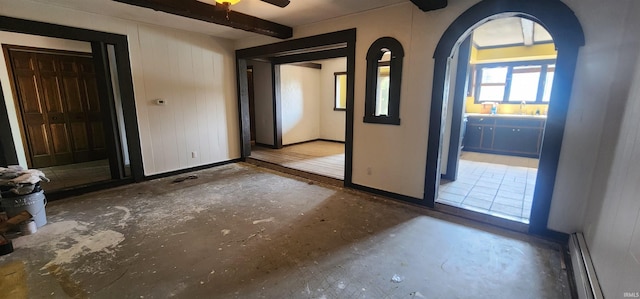 5002 Canterbury Dr, Fort Wayne, IN 46835 - entryway with a baseboard heating unit, arched walkways, baseboards, and a ceiling fan