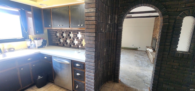 5002 Canterbury Dr, Fort Wayne, IN 46835 - kitchen featuring dishwasher, light countertops, and arched walkways