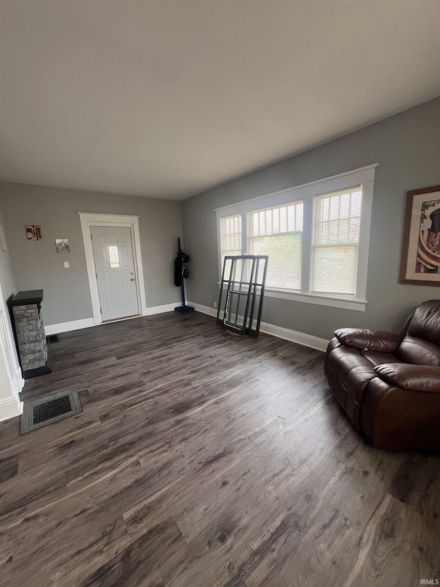 2319 S Main St, Elkhart, IN 46517 - living area featuring dark wood-type flooring and baseboards