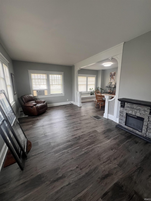 2319 S Main St, Elkhart, IN 46517 - living area with baseboards, dark wood finished floors, and cooling unit