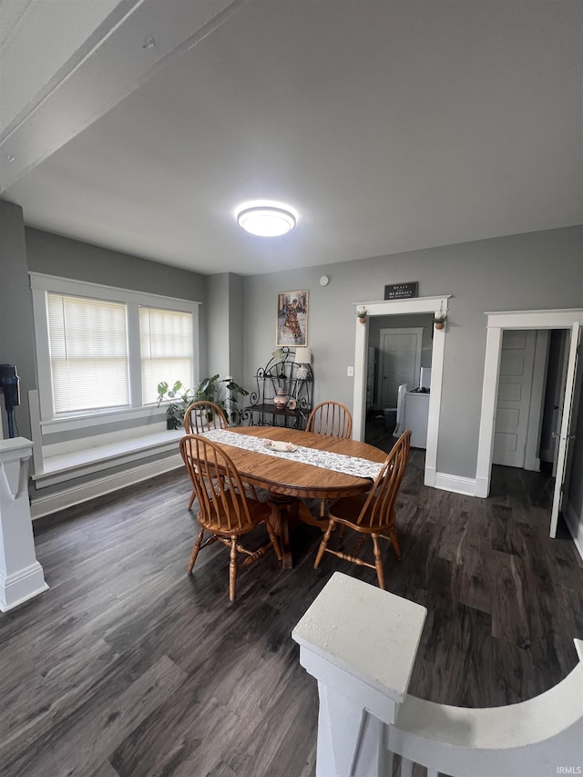 2319 S Main St, Elkhart, IN 46517 - dining area with dark wood-style flooring and baseboards