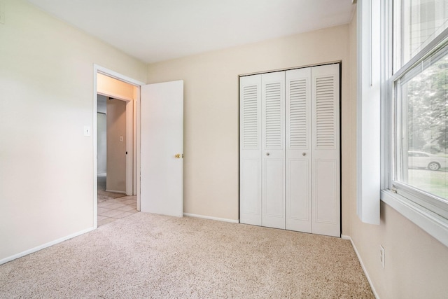 18363 Sheffield Ln, Bristol, IN 46507 - unfurnished bedroom featuring multiple windows, carpet, and a closet