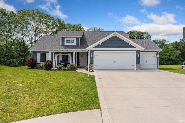 16995 Hatstick Ct, Fort Wayne, IN 46845 - craftsman inspired home featuring an attached garage, a front yard, driveway, a shingled roof, and stone siding