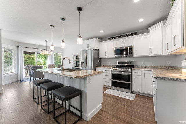 16995 Hatstick Ct, Fort Wayne, IN 46845 - kitchen featuring stainless steel appliances, a sink, dark wood finished floors, recessed lighting, and white cabinets