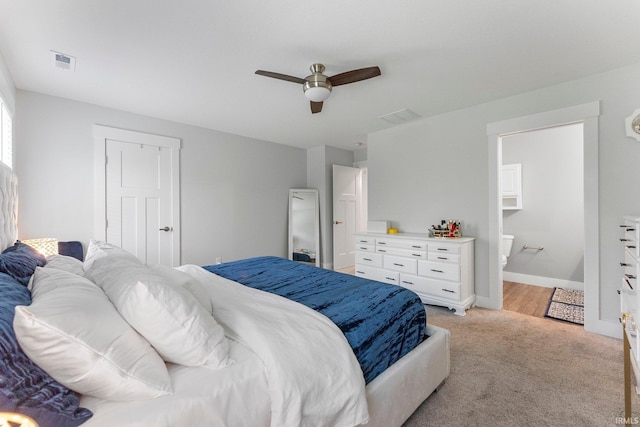 16995 Hatstick Ct, Fort Wayne, IN 46845 - bedroom with light colored carpet, a ceiling fan, baseboards, and ensuite bathroom