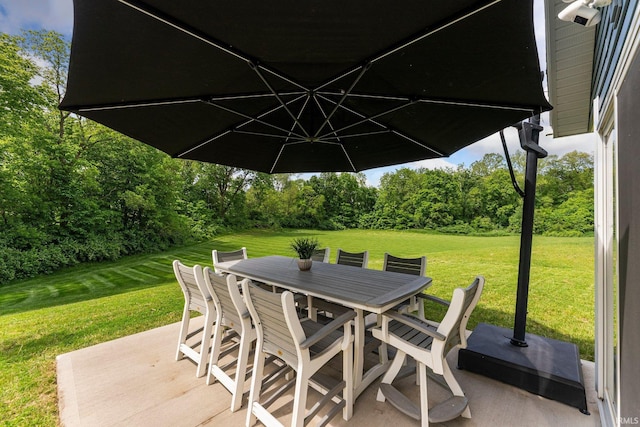 16995 Hatstick Ct, Fort Wayne, IN 46845 - view of patio / terrace featuring outdoor dining space and view of scattered trees
