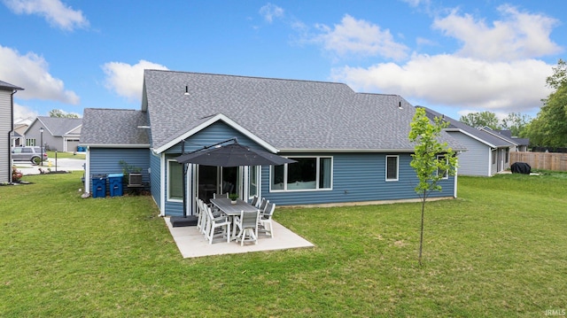 16995 Hatstick Ct, Fort Wayne, IN 46845 - rear view of house featuring roof with shingles, a yard, and a patio