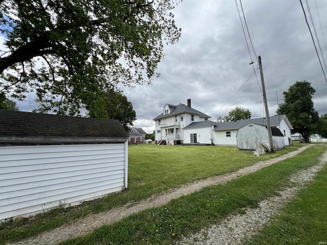 102 W Hackett St, Carlisle, IN 47838 - view of home's exterior featuring a lawn