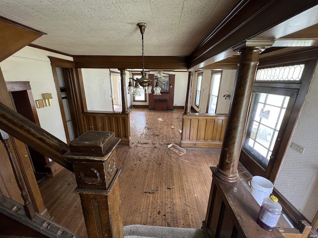 102 W Hackett St, Carlisle, IN 47838 - corridor featuring hardwood / wood-style floors, a chandelier, and decorative columns
