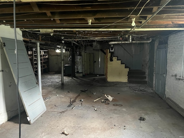 102 W Hackett St, Carlisle, IN 47838 - unfinished basement with gas water heater and stairway