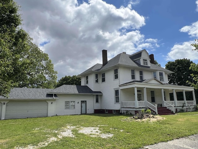 102 W Hackett St, Carlisle, IN 47838 - view of front facade with a chimney, a garage, a porch, a front lawn, and roof with shingles