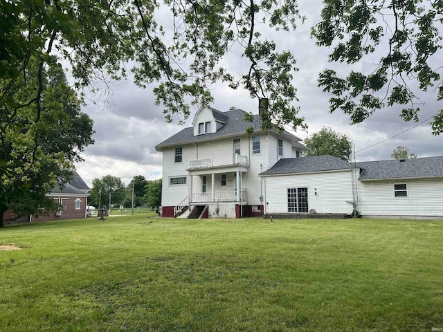 102 W Hackett St, Carlisle, IN 47838 - rear view of house featuring a lawn, a chimney, and roof with shingles