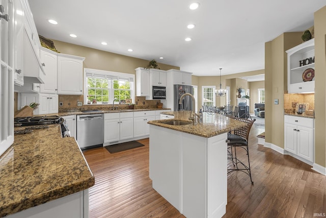 3 Brownstone Ct, Jasper, IN 47546 - kitchen with appliances with stainless steel finishes, a sink, backsplash, white cabinetry, and recessed lighting
