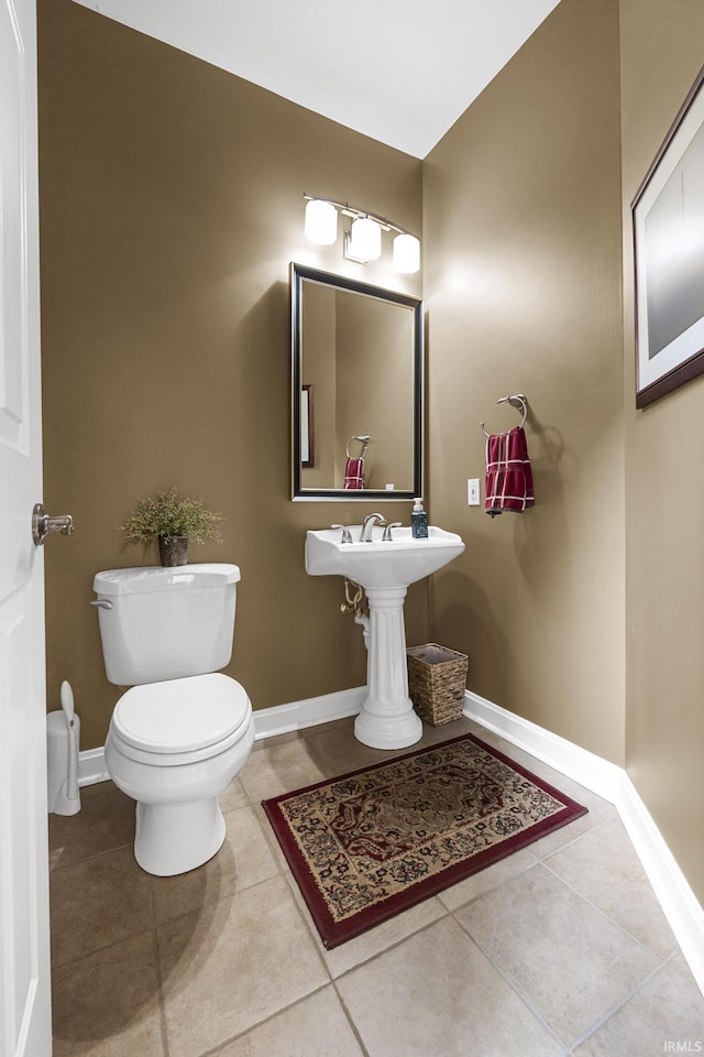 3 Brownstone Ct, Jasper, IN 47546 - bathroom featuring toilet, tile patterned flooring, and baseboards