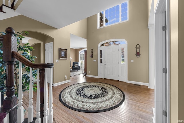 3 Brownstone Ct, Jasper, IN 47546 - entryway featuring wood finished floors, baseboards, and a high ceiling