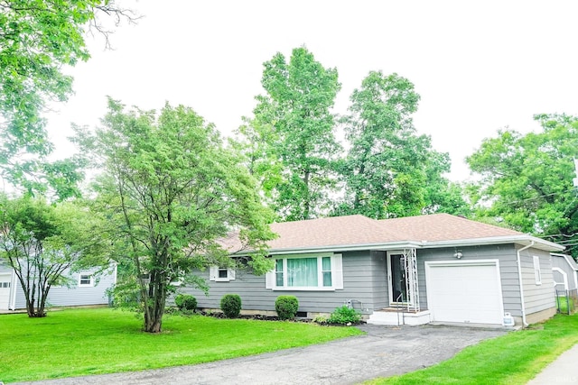 6613 E Hickory Ln, Muncie, IN 47303 - ranch-style home with an attached garage, a front lawn, asphalt driveway, and a shingled roof
