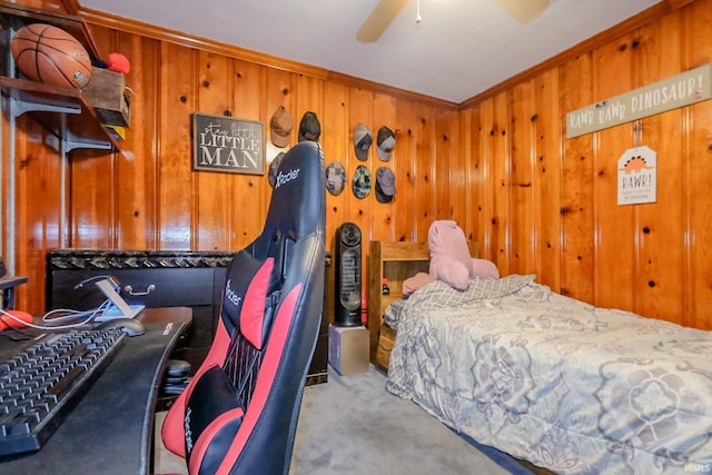 6613 E Hickory Ln, Muncie, IN 47303 - carpeted bedroom with ornamental molding, wooden walls, and a ceiling fan