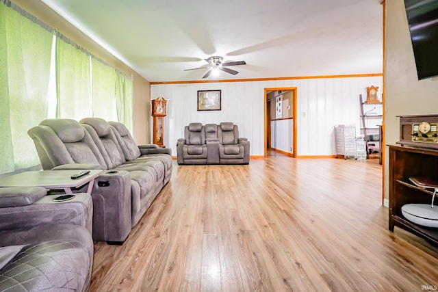 6613 E Hickory Ln, Muncie, IN 47303 - living area featuring light wood-type flooring, a ceiling fan, baseboards, and ornamental molding
