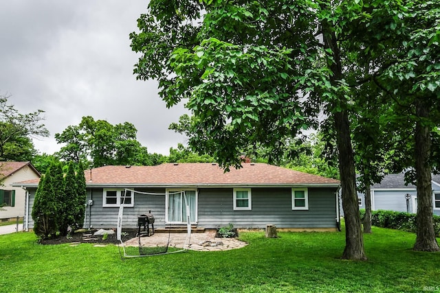 6613 E Hickory Ln, Muncie, IN 47303 - back of house with a lawn and a patio area