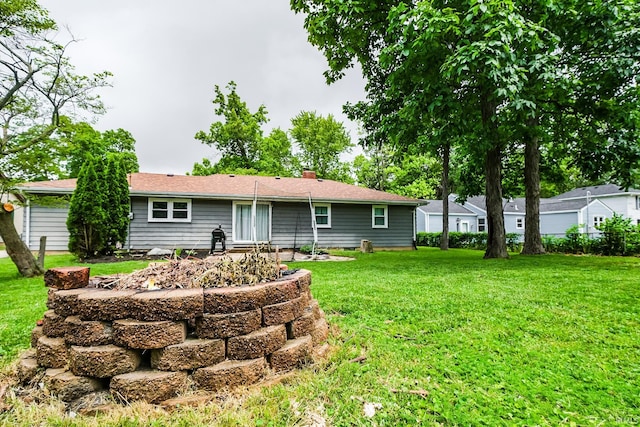 6613 E Hickory Ln, Muncie, IN 47303 - back of property with a yard and a chimney