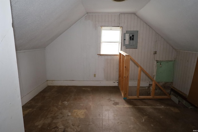 744 First St, Huntington, IN 46750 - additional living space featuring electric panel, vaulted ceiling, and wooden walls