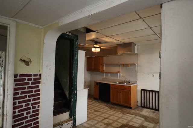 744 First St, Huntington, IN 46750 - kitchen with a sink, light flooring, brown cabinets, light countertops, and a ceiling fan