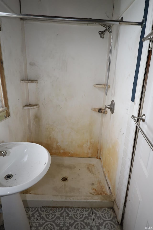744 First St, Huntington, IN 46750 - full bathroom featuring a shower and tile patterned flooring