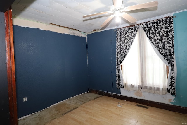 744 First St, Huntington, IN 46750 - spare room with ceiling fan, wood finished floors, and baseboards