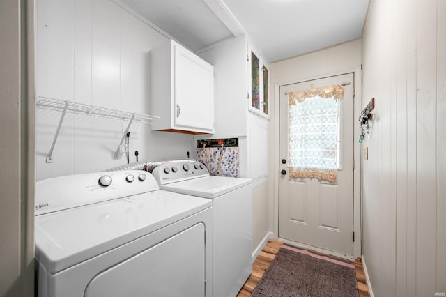 6521 Snug Harbour Ln, Unionville, IN 47468 - laundry room featuring cabinet space, washer and dryer, and light wood finished floors