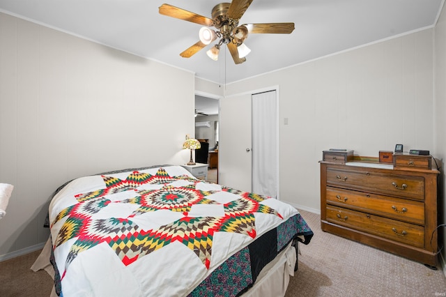 6521 Snug Harbour Ln, Unionville, IN 47468 - carpeted bedroom featuring ornamental molding, a closet, ceiling fan, and baseboards