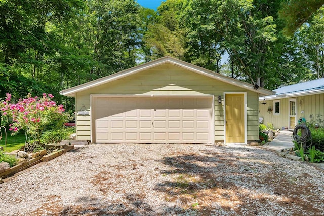 6521 Snug Harbour Ln, Unionville, IN 47468 - view of front of home featuring an outdoor structure and a garage