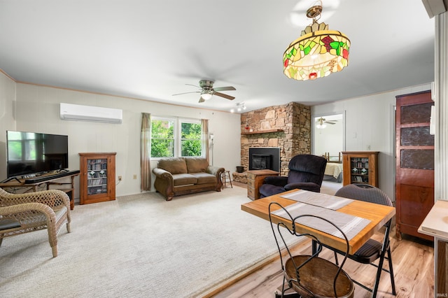 6521 Snug Harbour Ln, Unionville, IN 47468 - living room with a wall mounted air conditioner, ceiling fan, and a stone fireplace